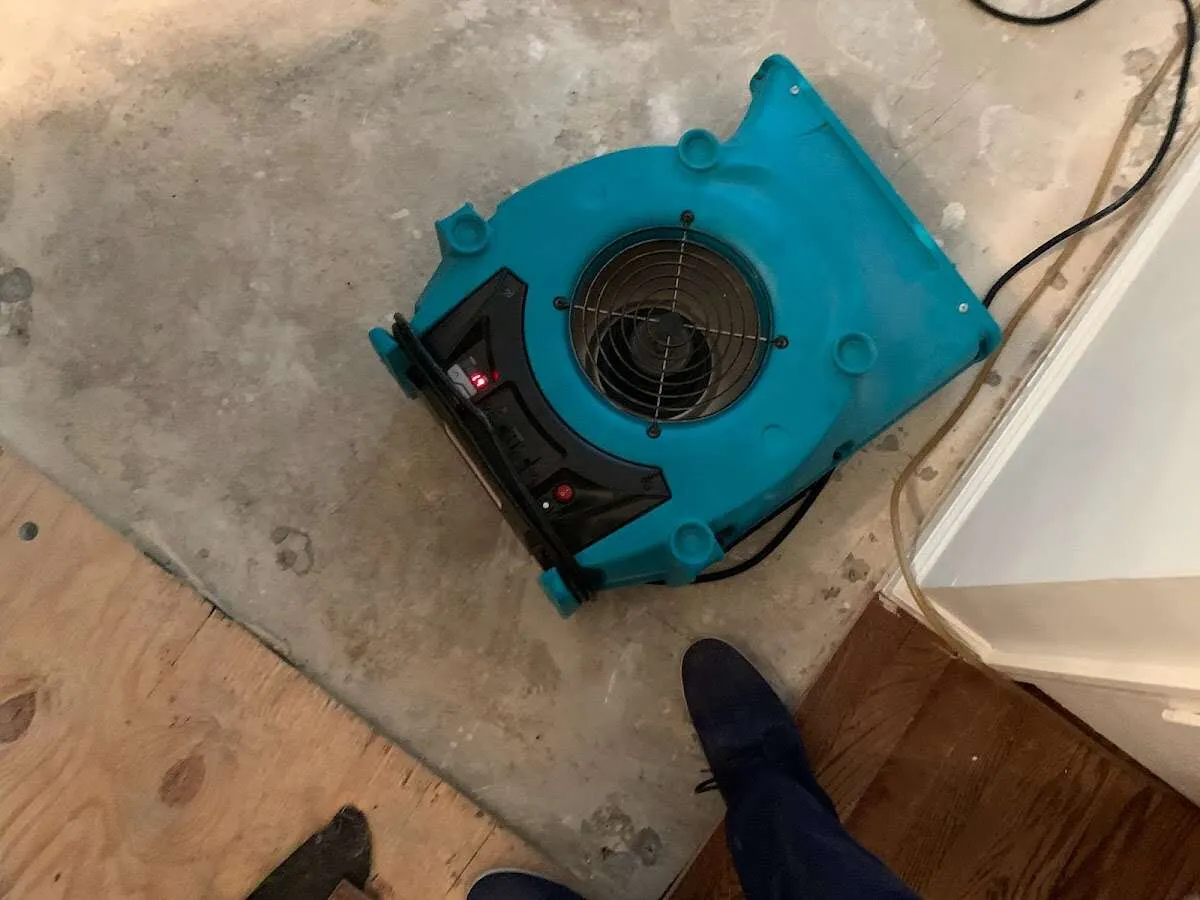 Air mover drying subfloor during Leak Detection & Repair in Steamboat Springs